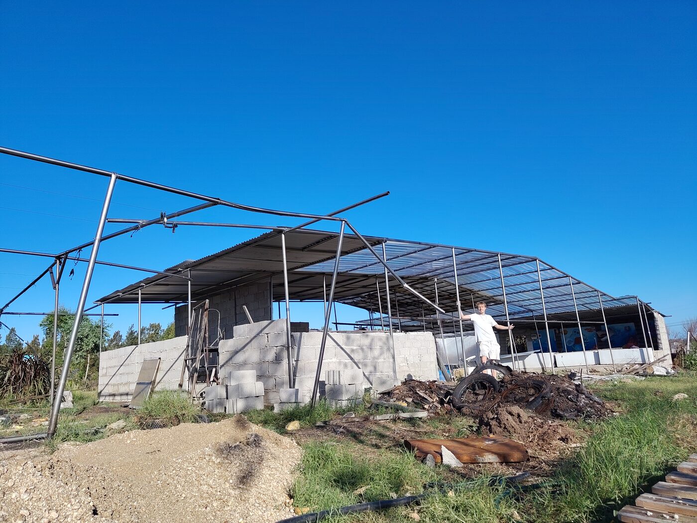 Alexander at Tierra de Sueños construction site, steel frame structure, Montevideo, Uruguay